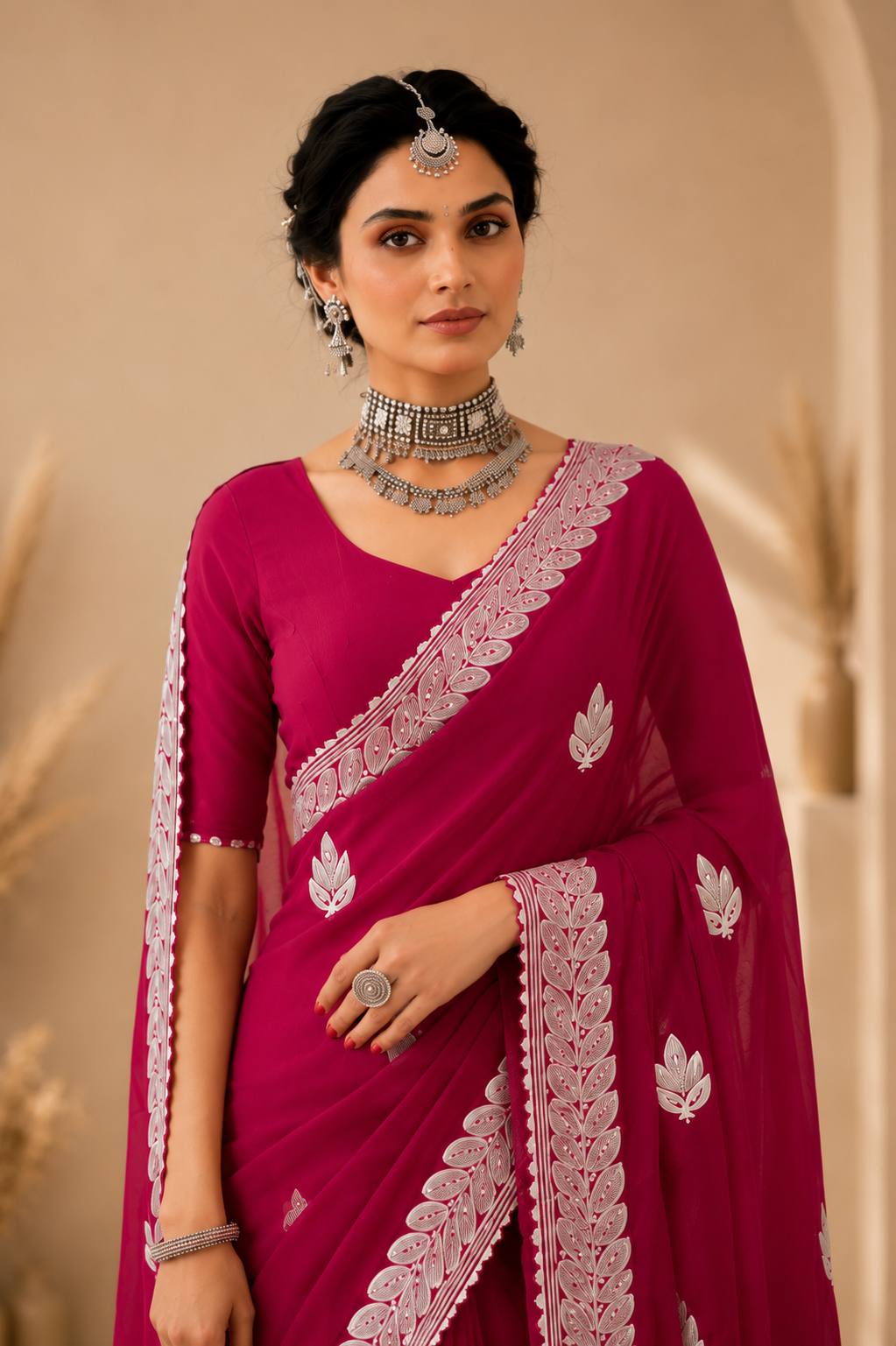 Radiant Rani Pink Embroidered Saree with Elegant Silver Floral Border